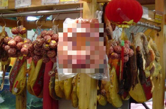 Как продают вяленые свиные головы в Китае 